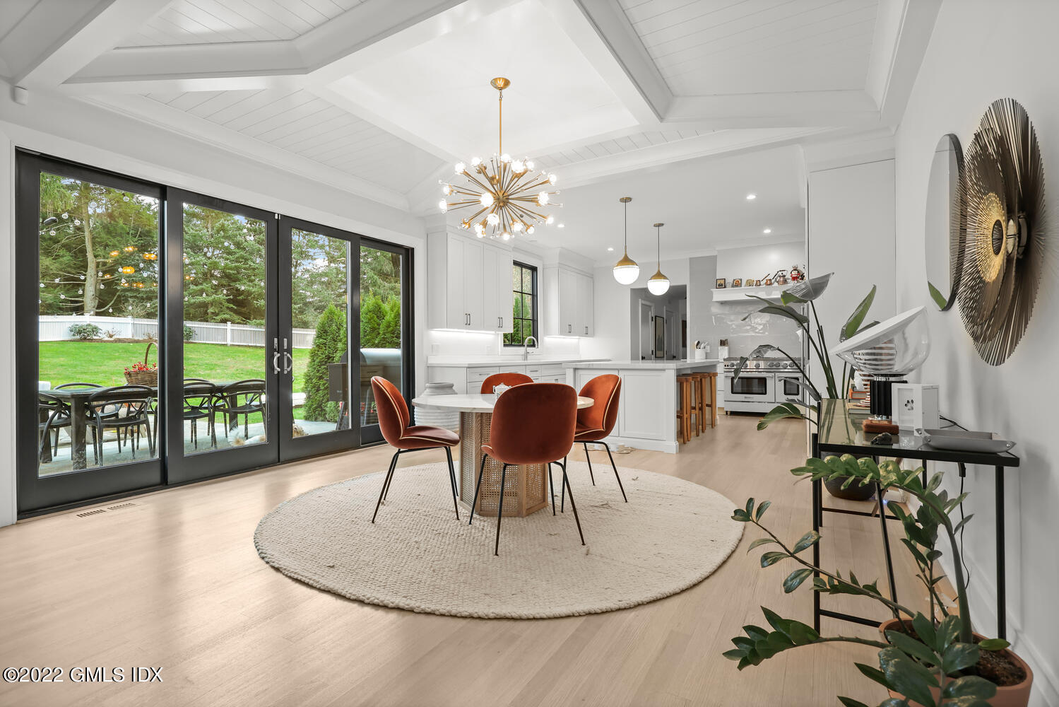 14 Copper Beech Road Greenwich, CT 06830 - Photo 12 of 48 a dining room with furniture a chandelier and wooden floor