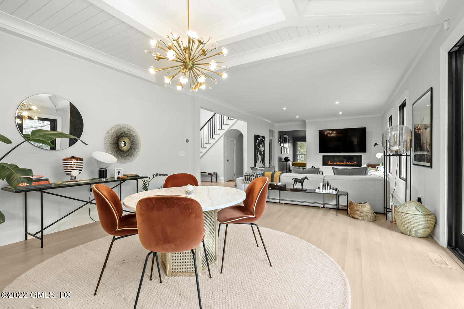 14 Copper Beech Road Greenwich, CT 06830 - Photo 13 of 48 a living room with furniture a flat screen tv and a chandelier