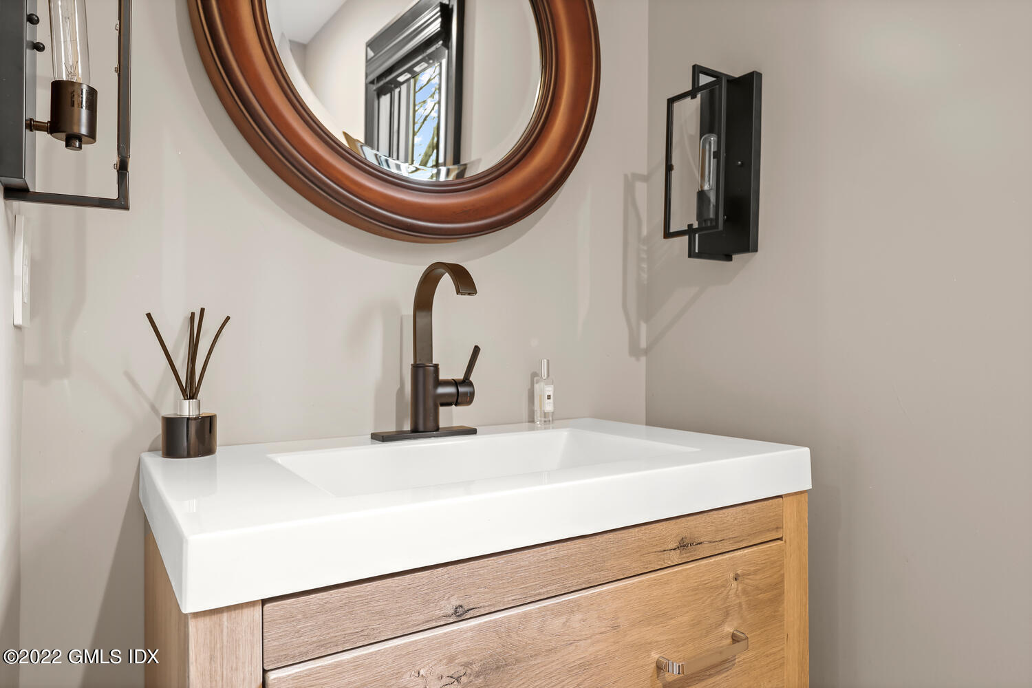 14 Copper Beech Road Greenwich, CT 06830 - Photo 20 of 48 a bathroom with a sink and a mirror