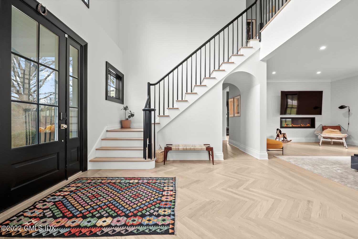 14 Copper Beech Road Greenwich, CT 06830 - Photo 2 of 48 a view of staircase with lots of frames and couches