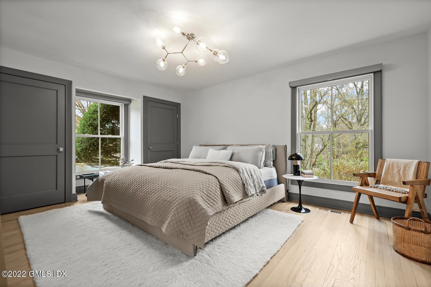 14 Copper Beech Road Greenwich, CT 06830 - Photo 21 of 48 a spacious bedroom with a bed and a large window