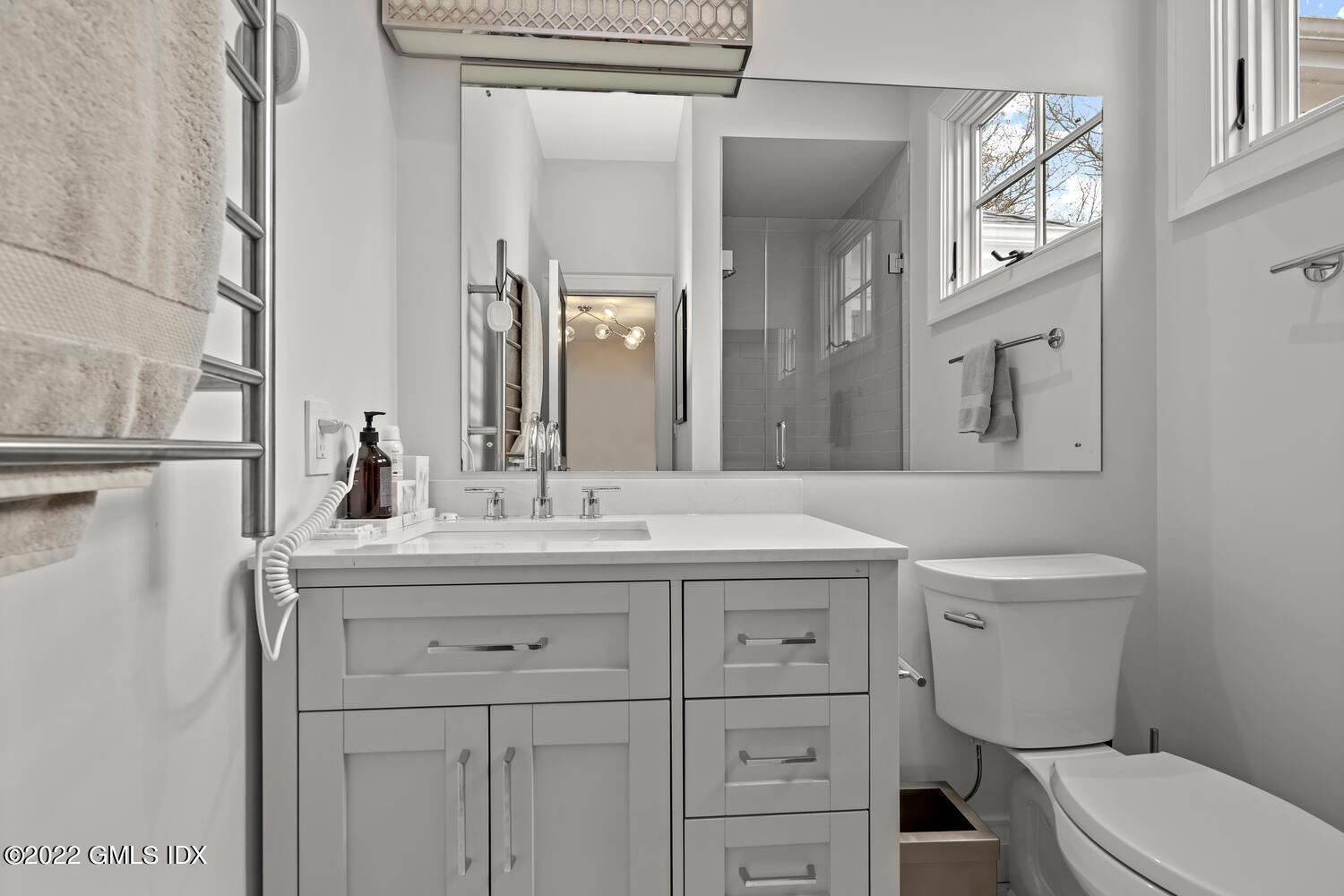 14 Copper Beech Road Greenwich, CT 06830 - Photo 24 of 48 a bathroom with a toilet a sink and mirror