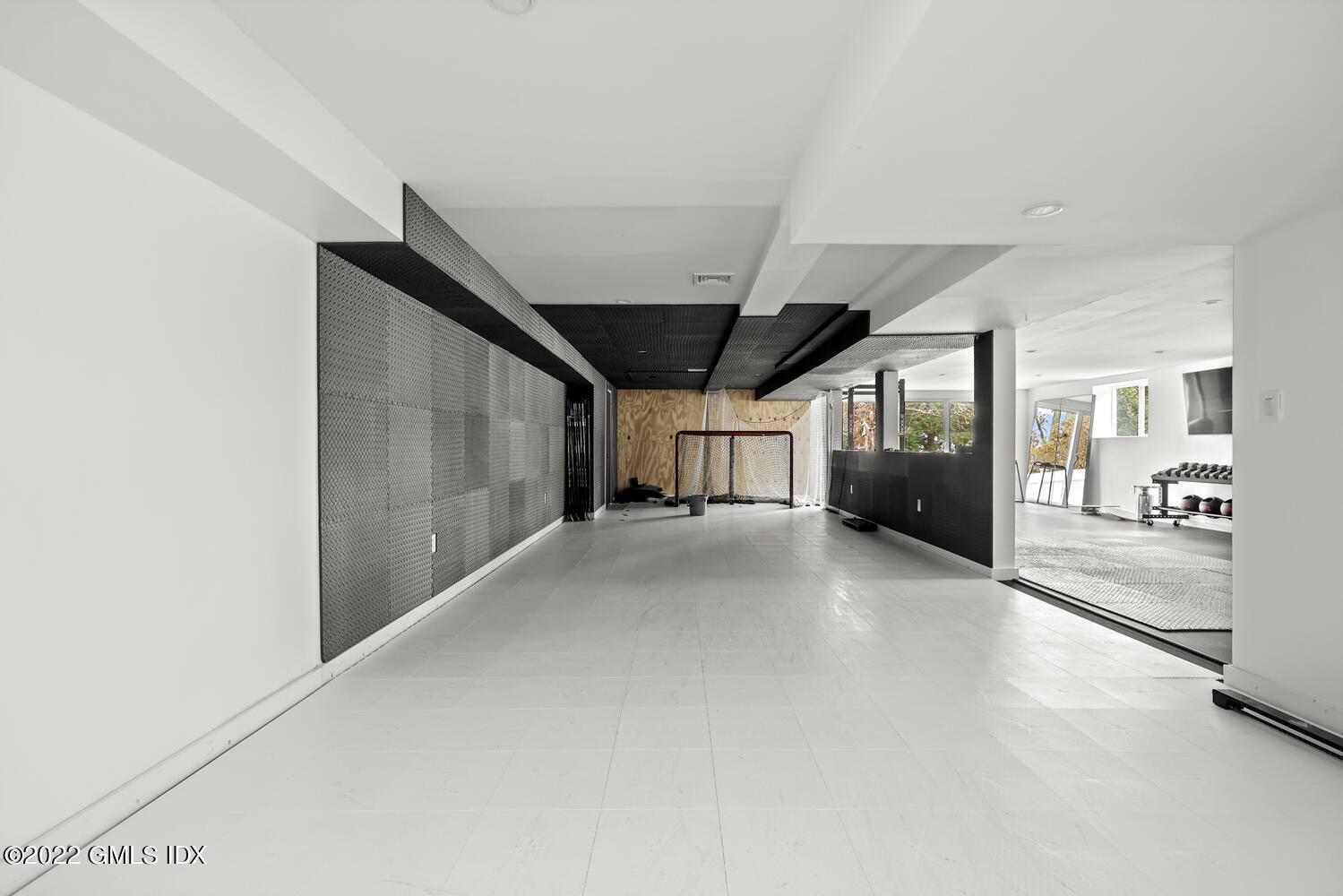 14 Copper Beech Road Greenwich, CT 06830 - Photo 39 of 48 a view of a hallway with a livingroom and furniture