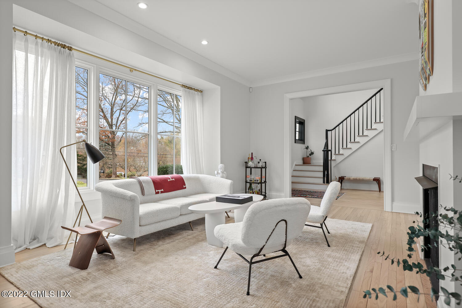 14 Copper Beech Road Greenwich, CT 06830 - Photo 4 of 48 a living room with furniture and a large window