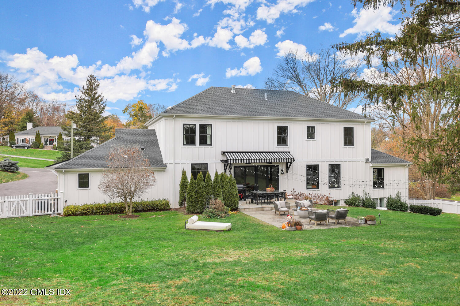 14 Copper Beech Road Greenwich, CT 06830 - Photo 42 of 48 a view of a house with a yard porch and sitting area