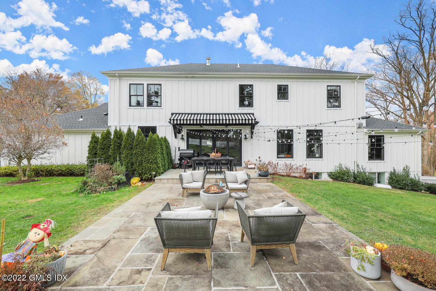 14 Copper Beech Road Greenwich, CT 06830 - Photo 43 of 48 a view of a house with backyard sitting area and garden