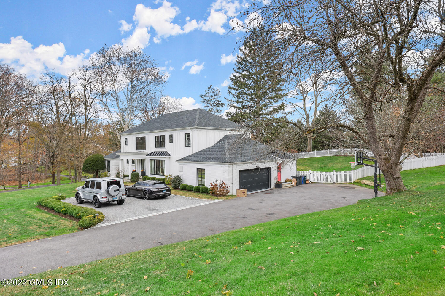 14 Copper Beech Road Greenwich, CT 06830 - Photo 44 of 48 a front view of a house with garden