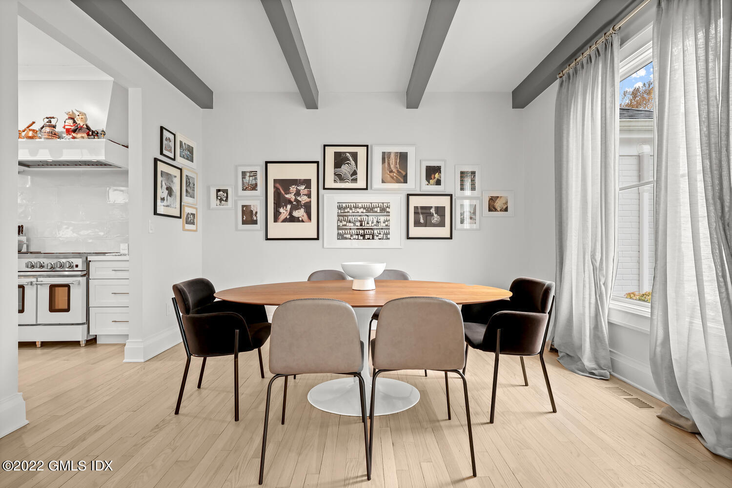14 Copper Beech Road Greenwich, CT 06830 - Photo 6 of 48 a view of a dining room with furniture and a window
