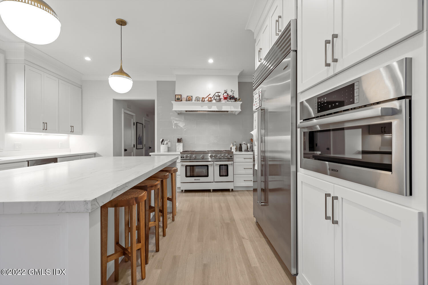 14 Copper Beech Road Greenwich, CT 06830 - Photo 8 of 48 a kitchen with stainless steel appliances kitchen island granite countertop a large stove a sink and a refrigerator