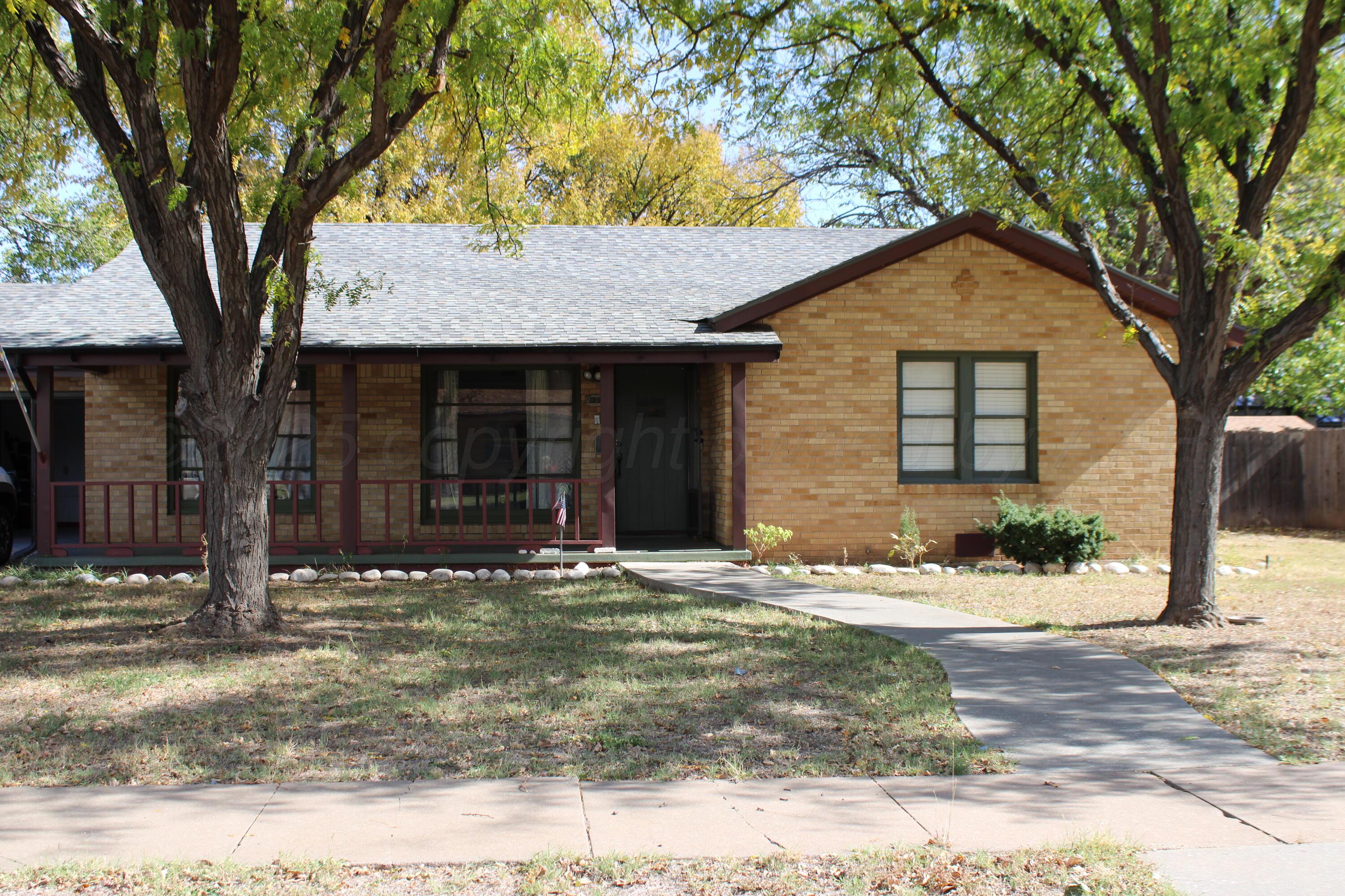 1219 South Bryan Street Amarillo, TX 79102 - Photo 1 of 1 a front view of a house with a yard