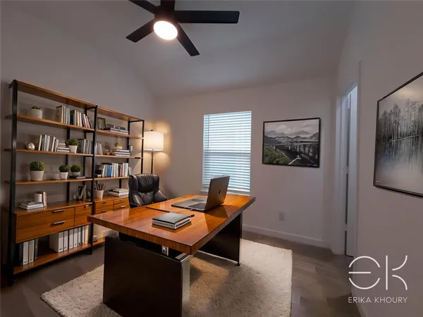a work room with furniture and window