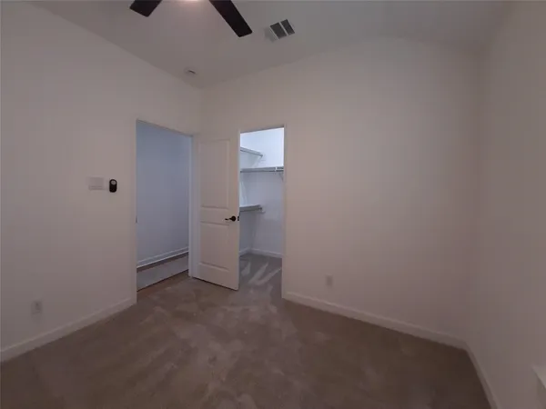 an empty room with a empty space and windows