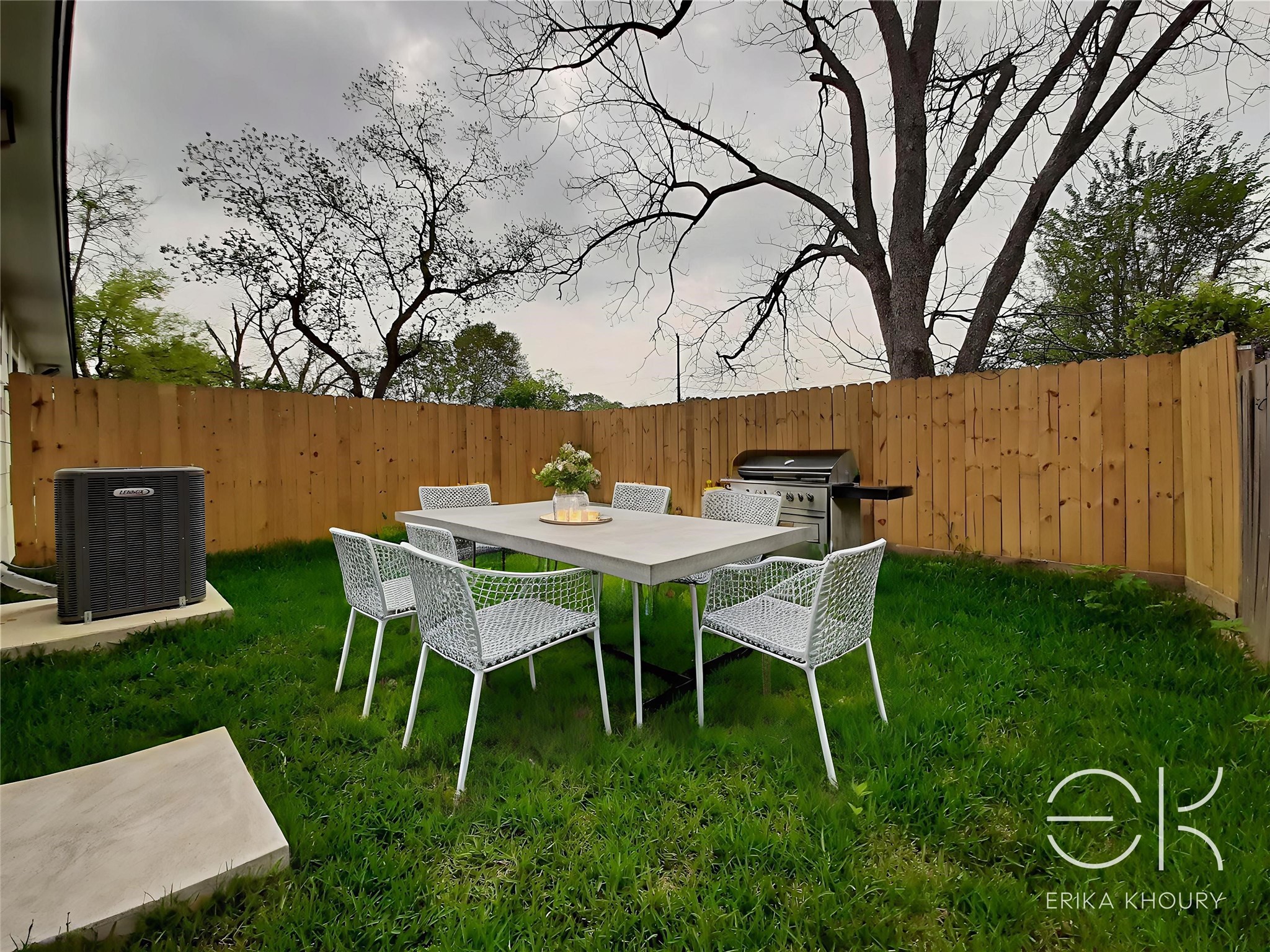 4530 Mayflower Street Houston, TX 77051 - Photo 21 of 21 a backyard with table and chairs with wooden fence