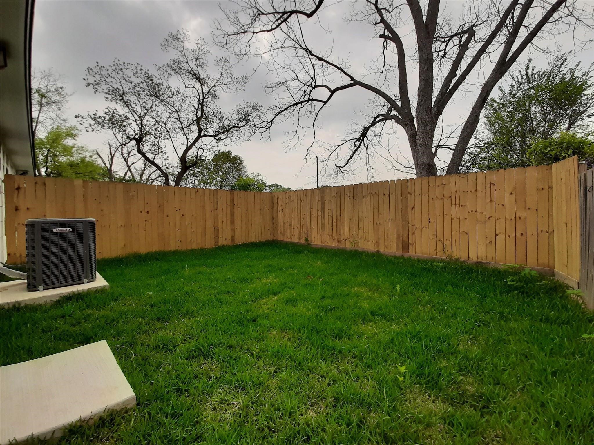 4530 Mayflower Street Houston, TX 77051 - Photo 8 of 21 a view of backyard with wooden fence