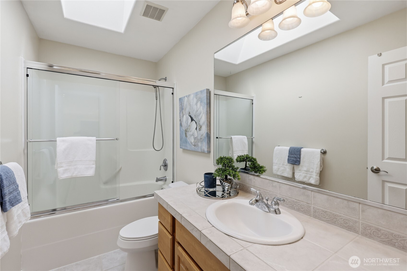 4354 Northwest Westgate Road Silverdale, WA 98383 - Photo 26 of 40 a bathroom with a sink toilet tub and shower