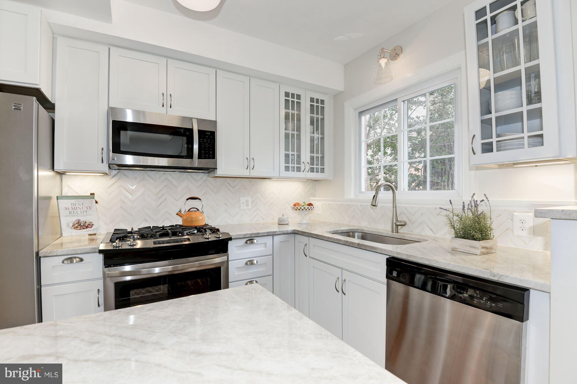 1656 Preston Road Alexandria, VA 22302 - Photo 2 of 29 a kitchen with stainless steel appliances granite countertop a sink and a stove