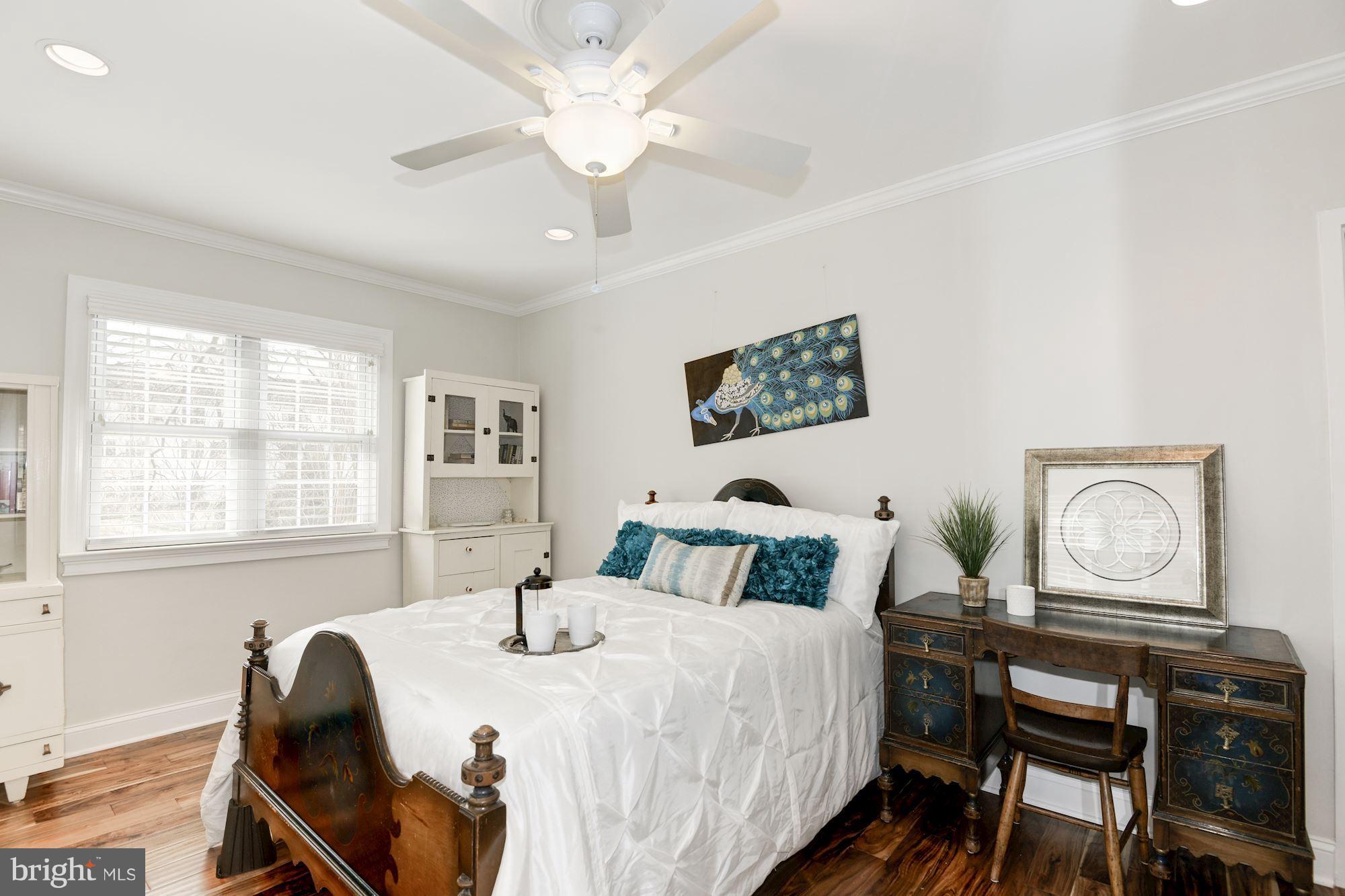 1656 Preston Road Alexandria, VA 22302 - Photo 9 of 29 a bedroom with a bed and a chandelier