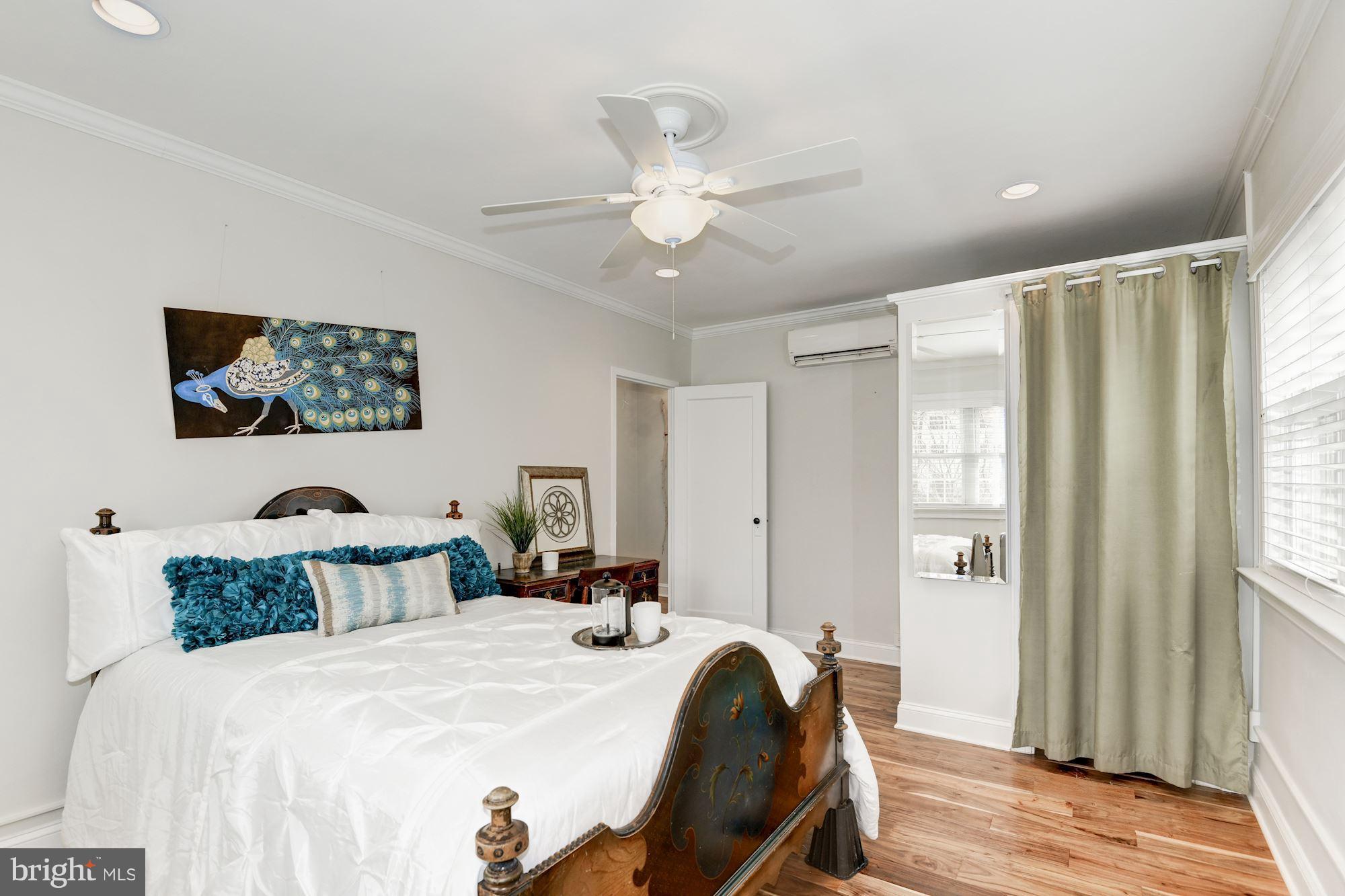 1656 Preston Road Alexandria, VA 22302 - Photo 10 of 29 a bedroom with a bed and a chandelier