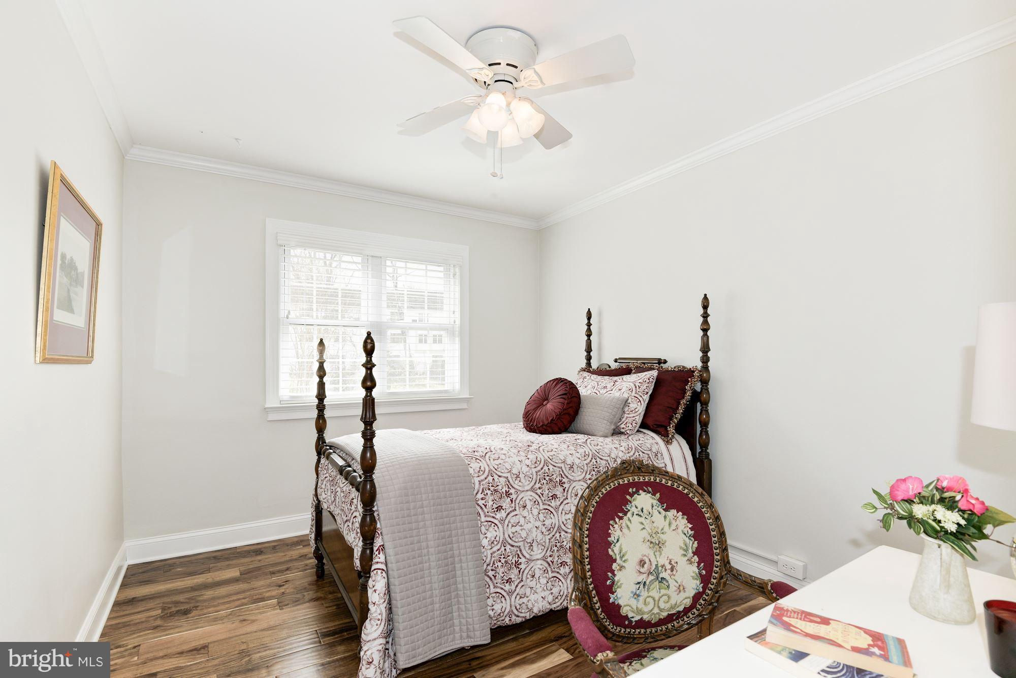 1656 Preston Road Alexandria, VA 22302 - Photo 12 of 29 a bedroom with a bed a chandelier and a window