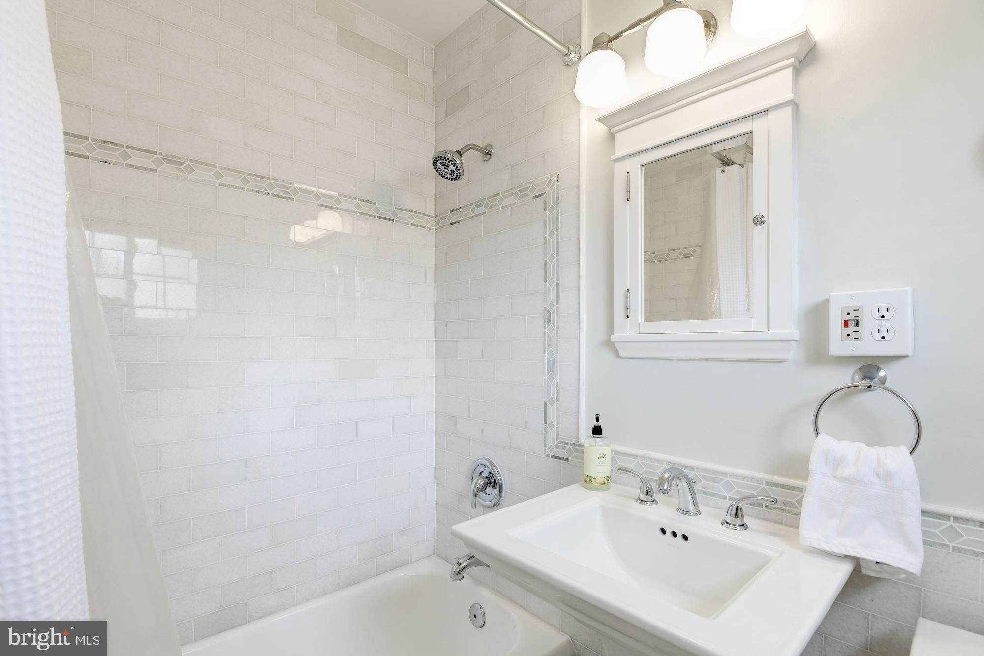 1656 Preston Road Alexandria, VA 22302 - Photo 13 of 29 a bathroom with a sink mirror and a shower