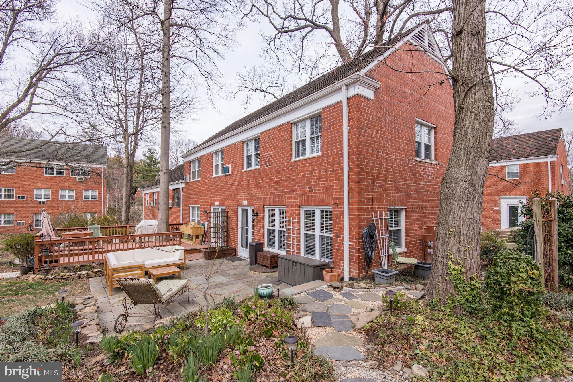 1656 Preston Road Alexandria, VA 22302 - Photo 16 of 29 a front view of a building with garden and sitting area