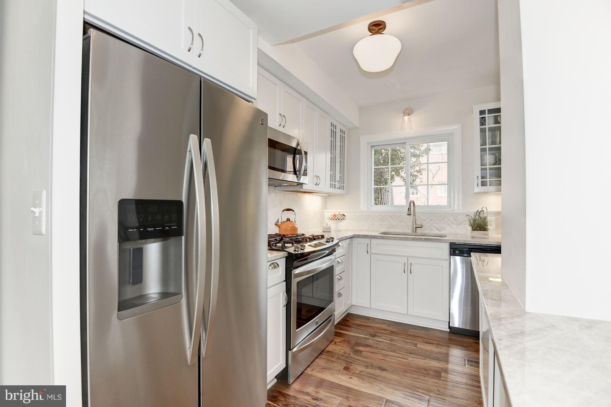 1656 Preston Road Alexandria, VA 22302 - Photo 3 of 29 a kitchen with a refrigerator and a sink