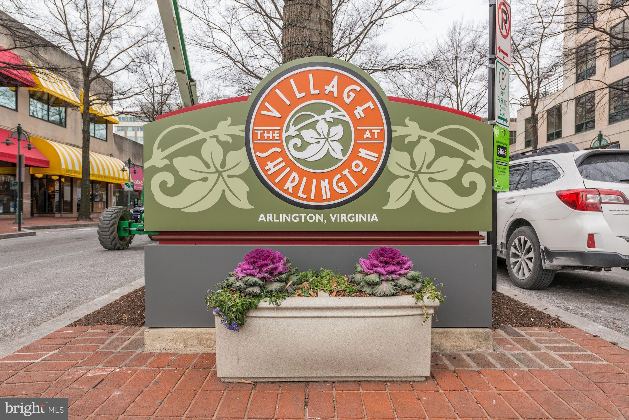 1656 Preston Road Alexandria, VA 22302 - Photo 22 of 29 a street sign with a bunch of flowers and trees