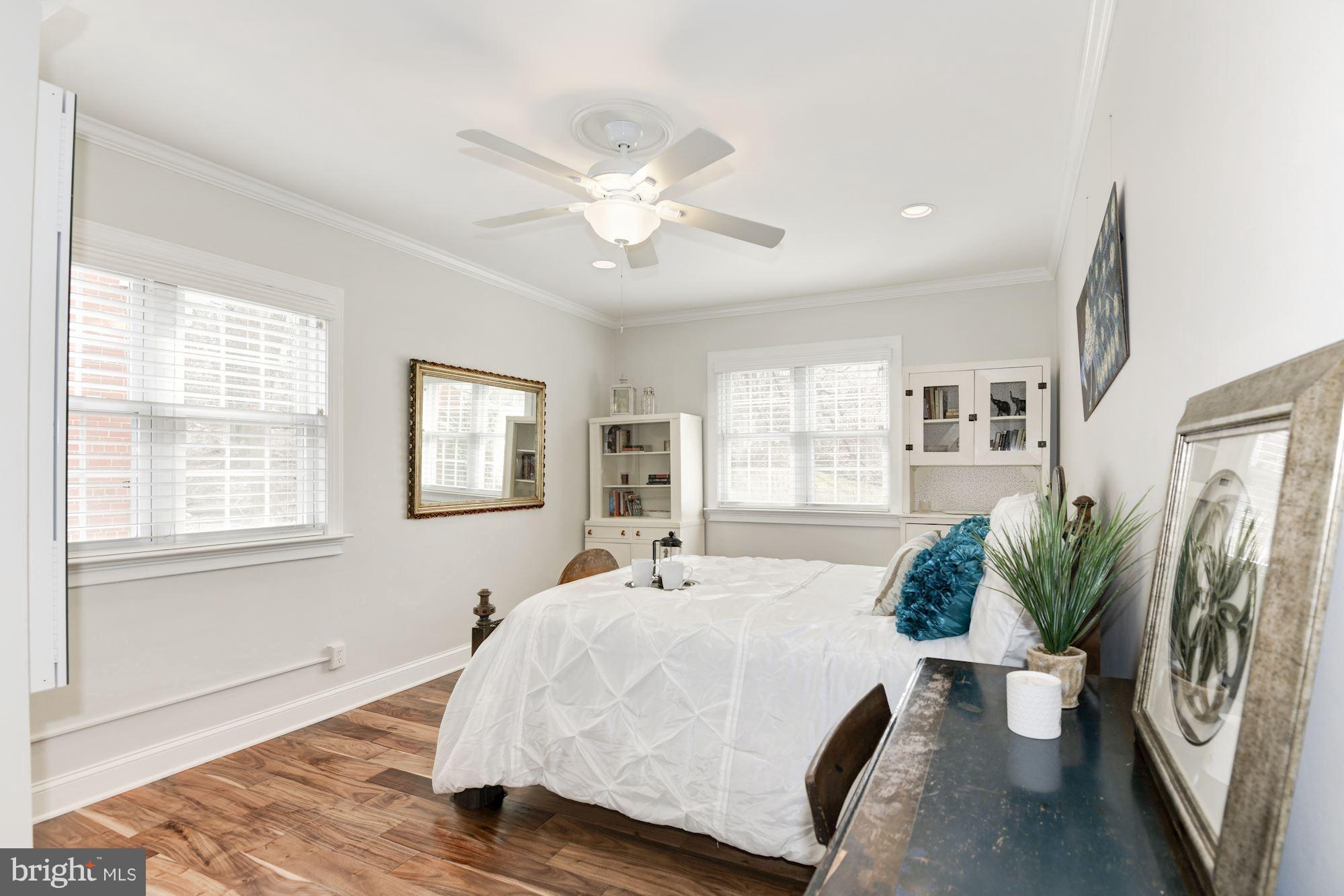 1656 Preston Road Alexandria, VA 22302 - Photo 8 of 29 a bedroom with a large bed and a chandelier
