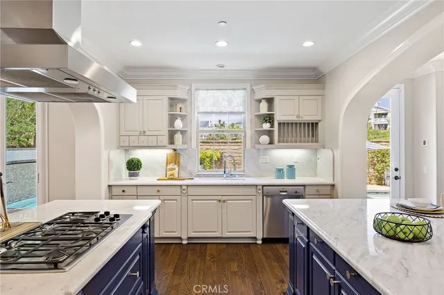 a kitchen with a stove a sink and a refrigerator