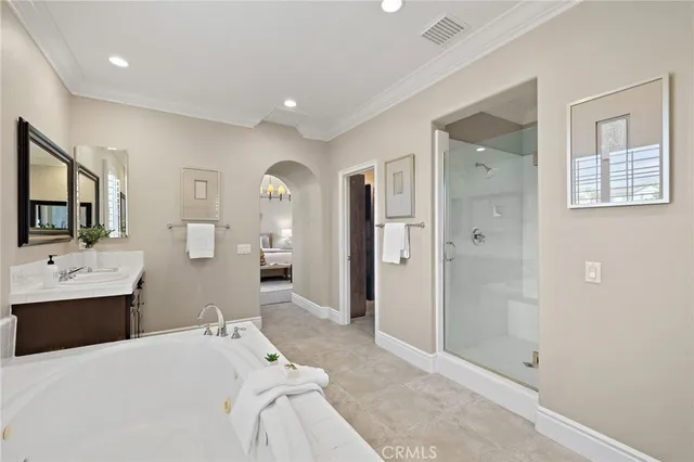 a bedroom with a bed and a view of bathroom