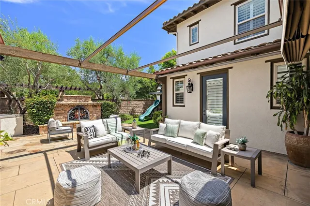 a outdoor space with patio the couches and a potted plant on the table