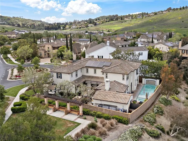 an aerial view of a house with a garden