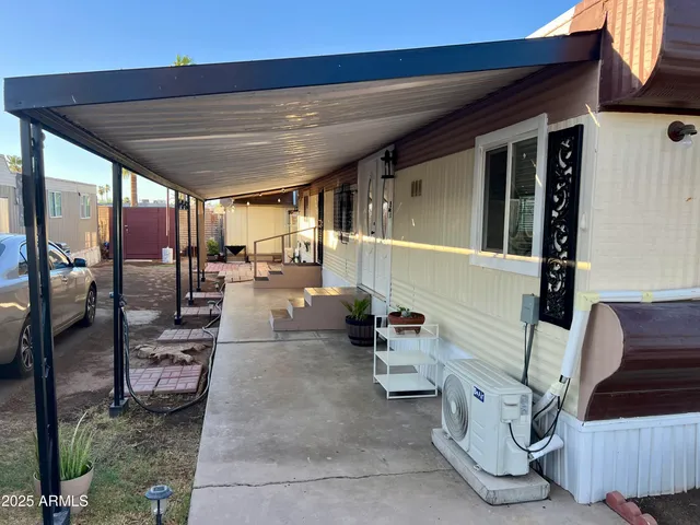 a view of a porch with furniture and a ceiling fan