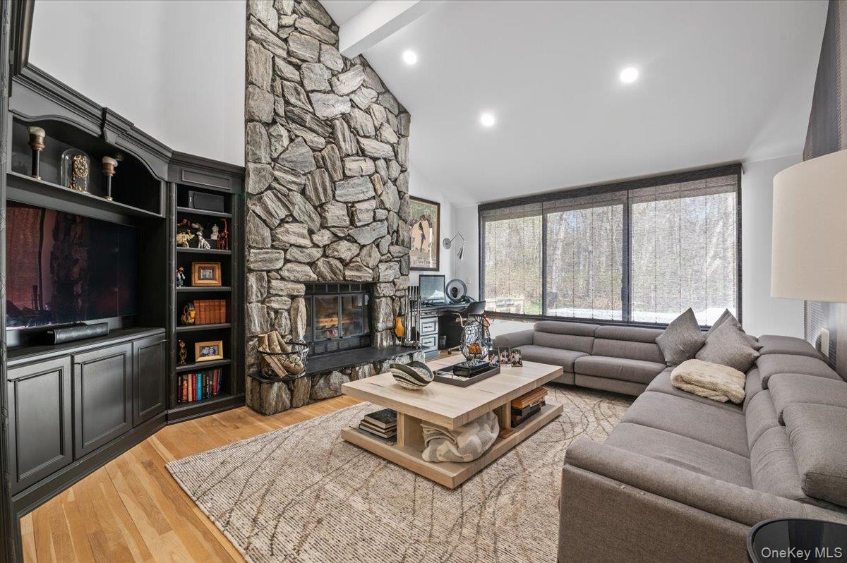 45 Coves Run Syosset, NY 11791 - Photo 14 of 43 a living room with fireplace furniture and a flat screen tv
