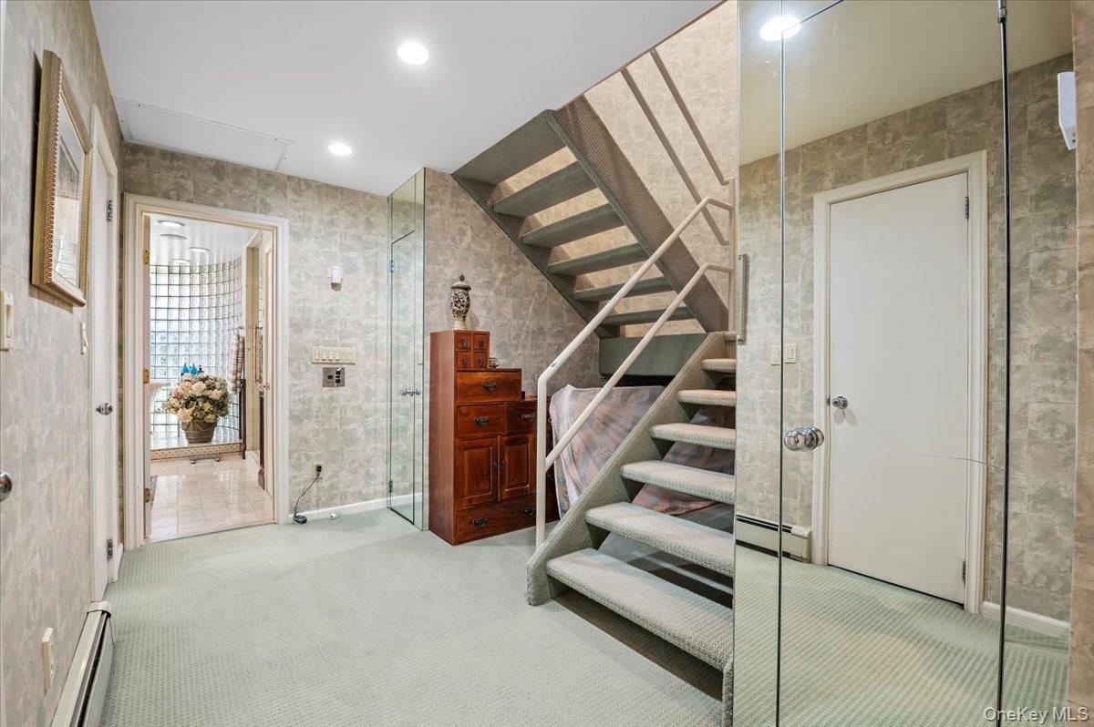 45 Coves Run Syosset, NY 11791 - Photo 18 of 43 a view of an entryway with staircase