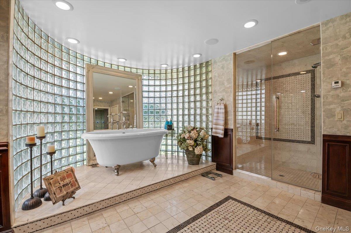 45 Coves Run Syosset, NY 11791 - Photo 21 of 43 a bathroom with a bathtub and a shower
