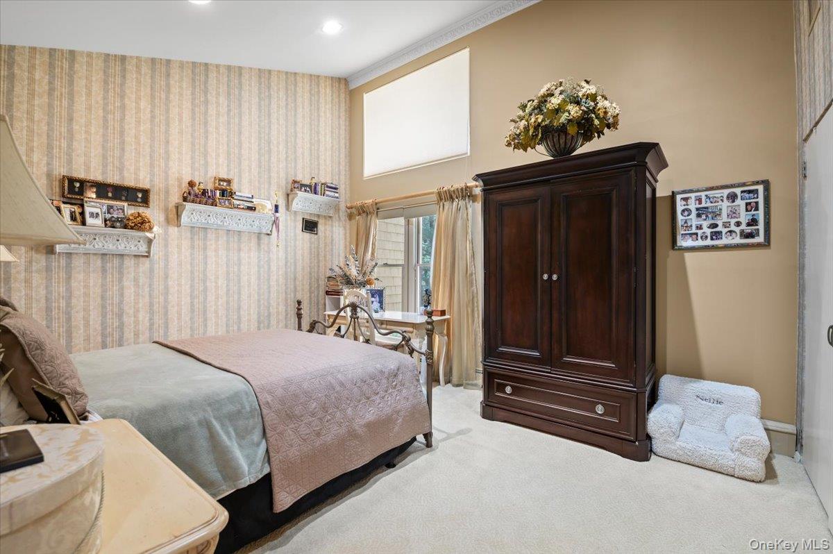 45 Coves Run Syosset, NY 11791 - Photo 22 of 43 a bedroom with a bed and a cabinet