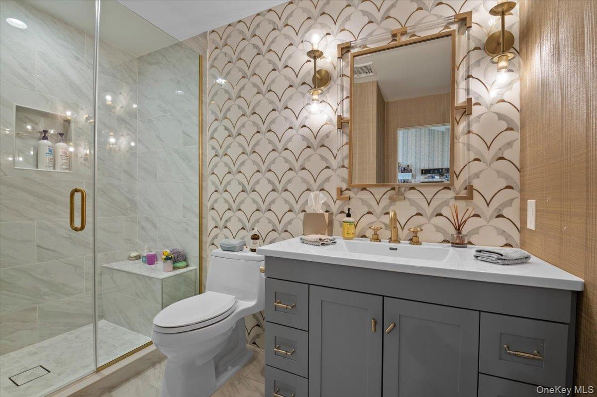 45 Coves Run Syosset, NY 11791 - Photo 23 of 43 a bathroom with a sink toilet and shower