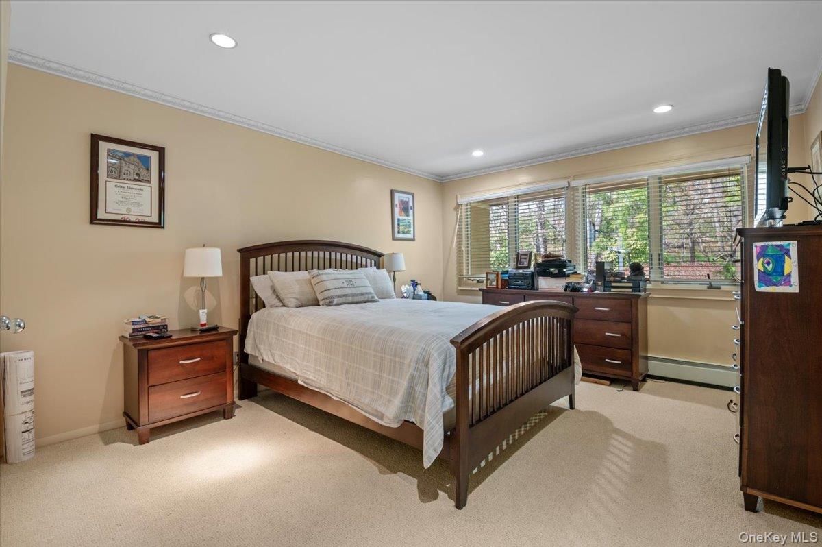 45 Coves Run Syosset, NY 11791 - Photo 24 of 43 a bedroom with a bed and wooden floor