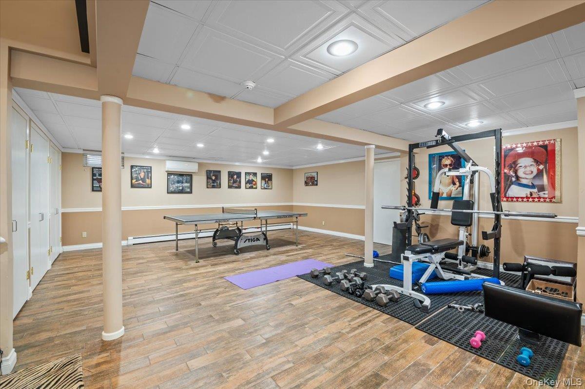 45 Coves Run Syosset, NY 11791 - Photo 30 of 43 a living room with furniture and wooden floor