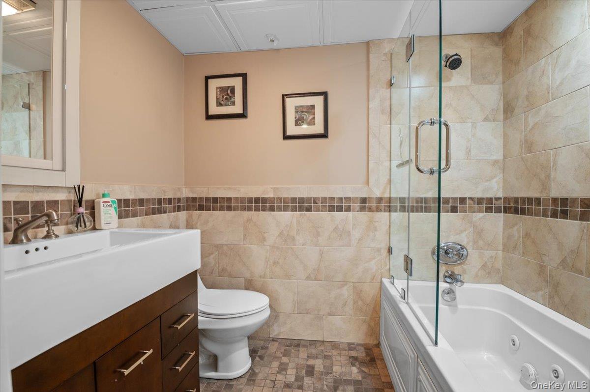 45 Coves Run Syosset, NY 11791 - Photo 35 of 43 a bathroom with a sink a toilet and shower