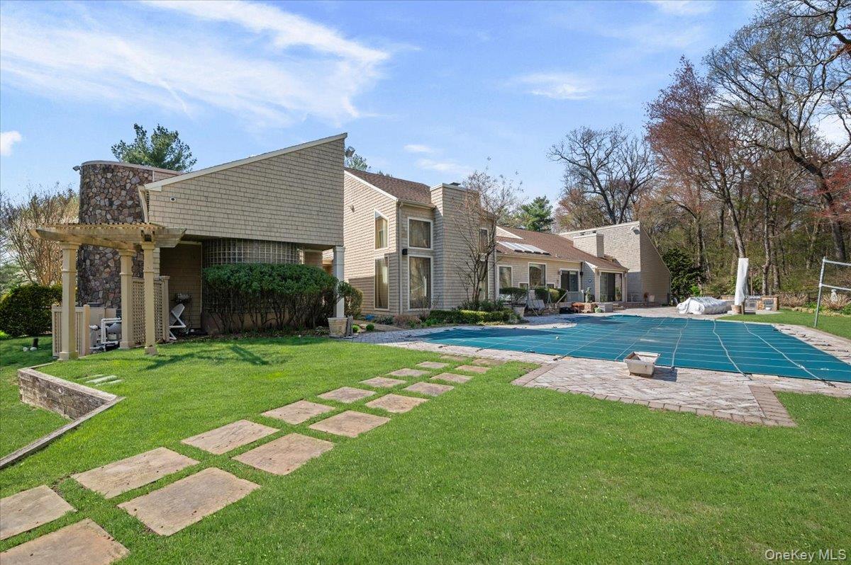 45 Coves Run Syosset, NY 11791 - Photo 39 of 43 a view of a house with a big yard plants and large trees