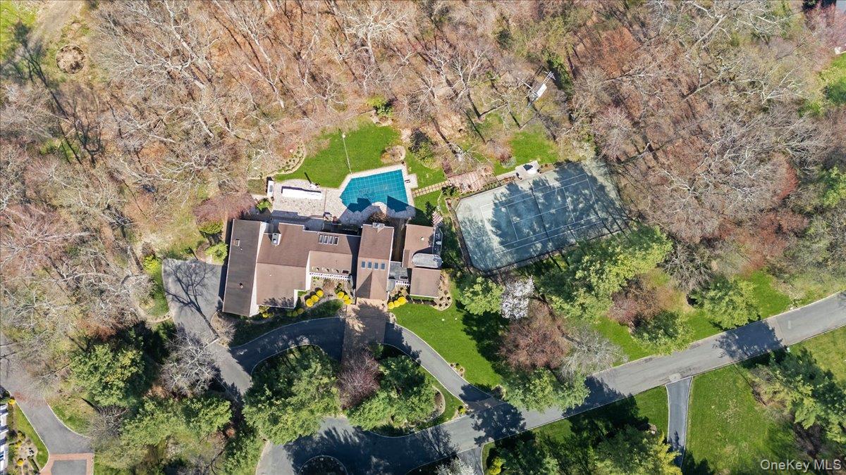 45 Coves Run Syosset, NY 11791 - Photo 4 of 43 an aerial view of a house with a yard and lake view