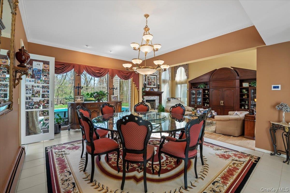 45 Coves Run Syosset, NY 11791 - Photo 9 of 43 a view of a dining room with furniture window and outside view