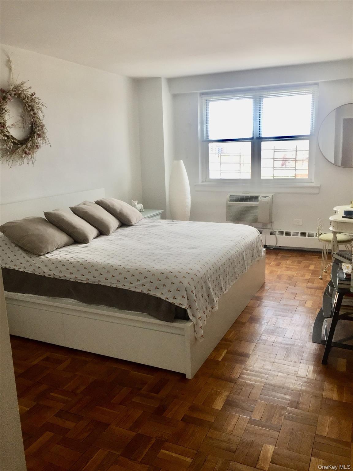 89-00 170th Street, Unit 6G Queens, NY 11432 - Photo 5 of 9 Bedroom featuring a baseboard heating unit