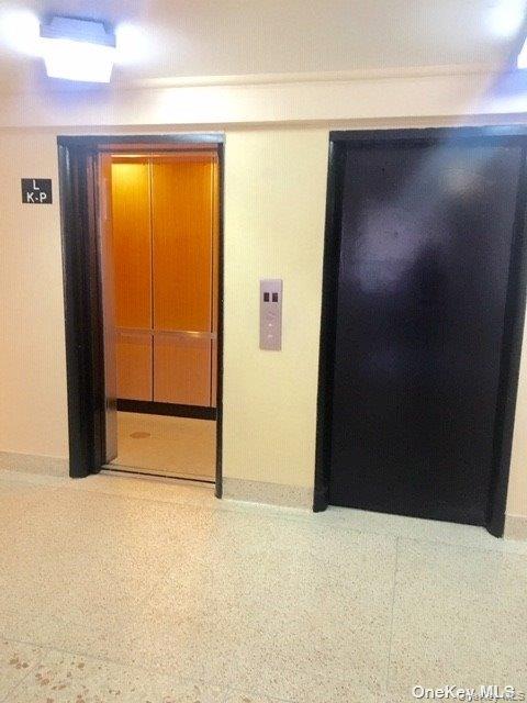 89-00 170th Street, Unit 6G Queens, NY 11432 - Photo 6 of 9 Corridor featuring elevator