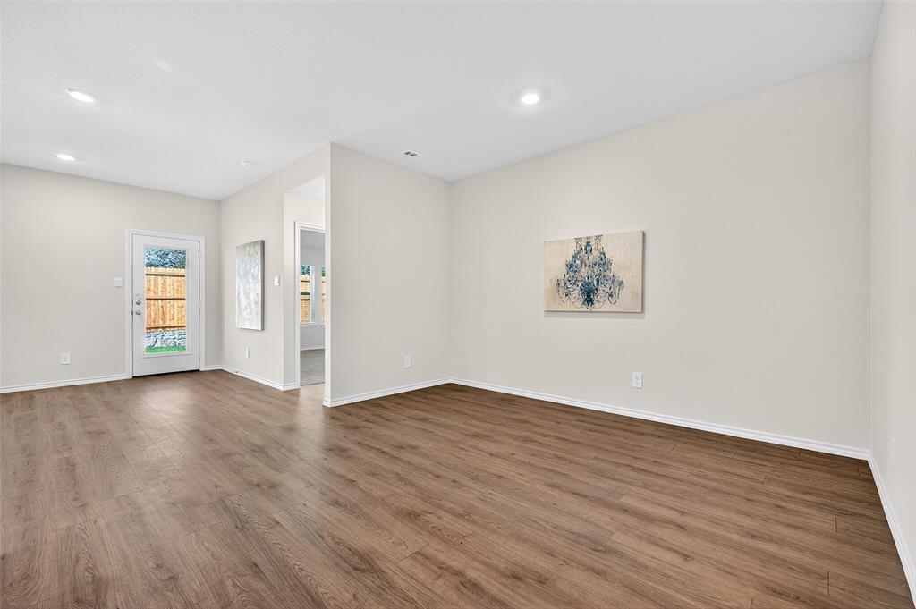 4208 Carnation Drive Sherman, TX 75090 - Photo 12 of 34 a view of an empty room with wooden floor and closet