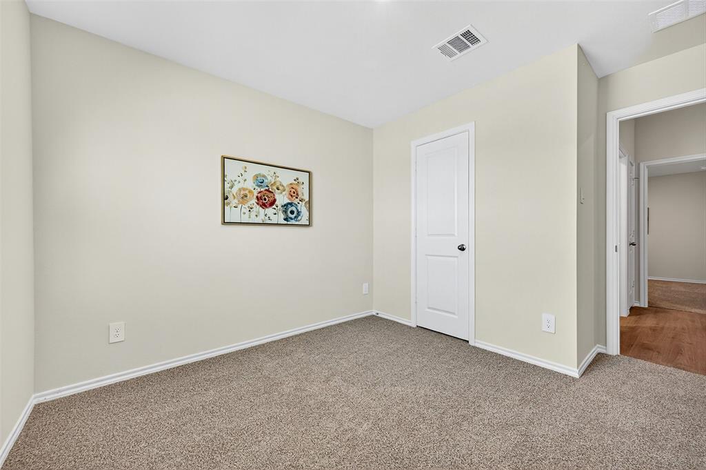 4208 Carnation Drive Sherman, TX 75090 - Photo 23 of 34 an empty room with a hallway