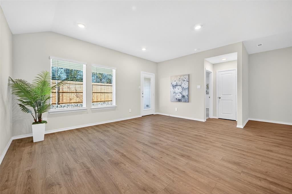 4208 Carnation Drive Sherman, TX 75090 - Photo 6 of 34 a view of an empty room with window and wooden floor