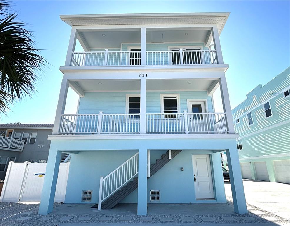711 Gulf Boulevard Indian Rocks Beach, FL 33785 - Photo 1 of 19 a view of a house with a balcony